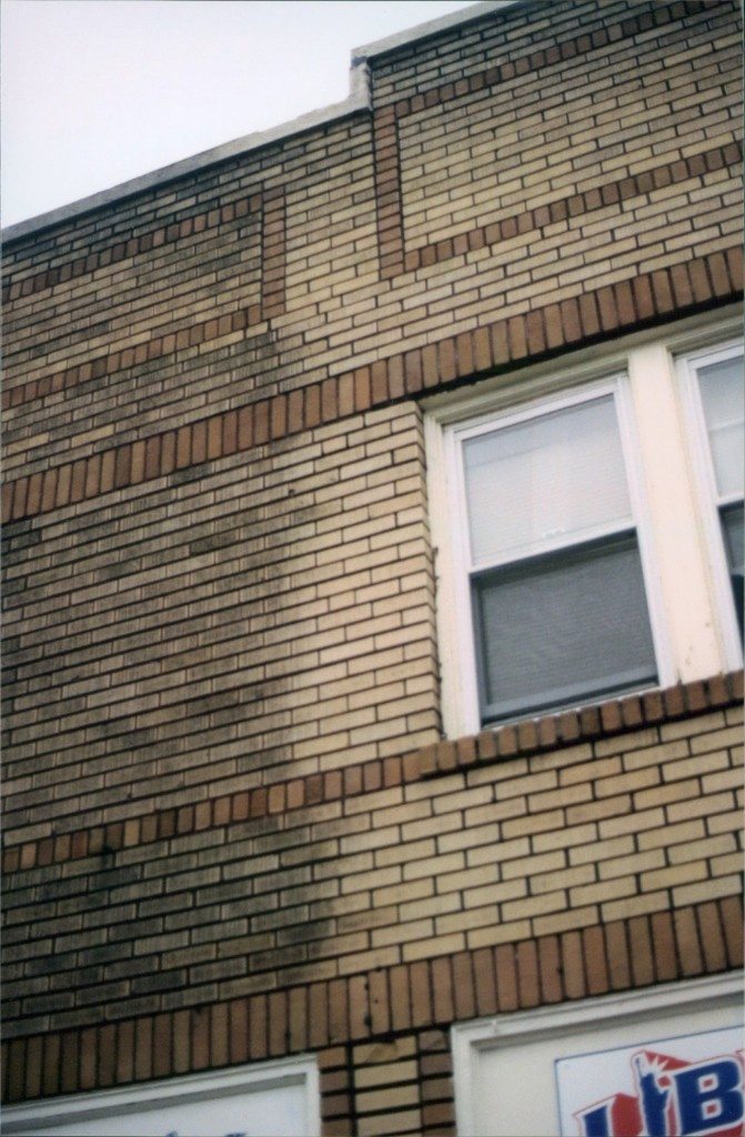 Before and after picture of restoring brick building