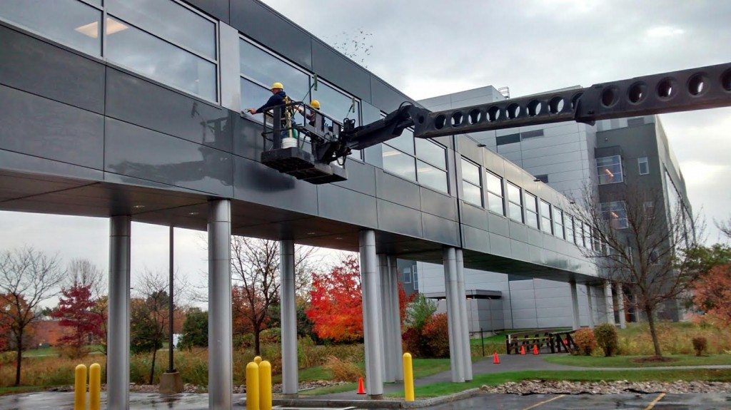 Window Cleaning on a pedestrian bridge that spans a canal.